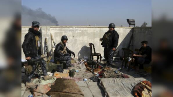 Iraqi forces seize third of west Mosul, Islamic State jihadists 'trapped'
