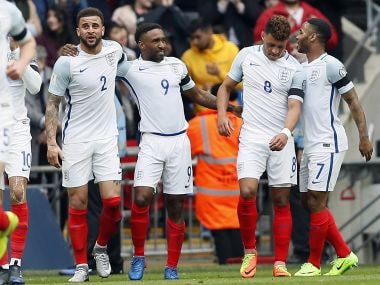 Jermain Defoe, third from right, celebrates coring with his England's teammates. AP Photo