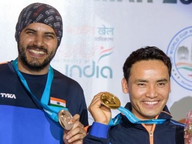 Jitu Rai and Amanpreet Singh pose with their respective medals at the ISSF World Cup in New Delhi. Twitter/ @ISSF