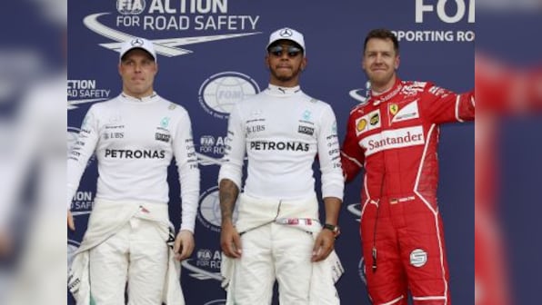 Australian Grand Prix: Lewis Hamilton staves off late challenge from Sebastian Vettel to seize pole position