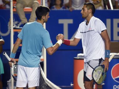 Nick Kyrgios (R) speaks to Novak Djokovic (L) after winning their match. AFP