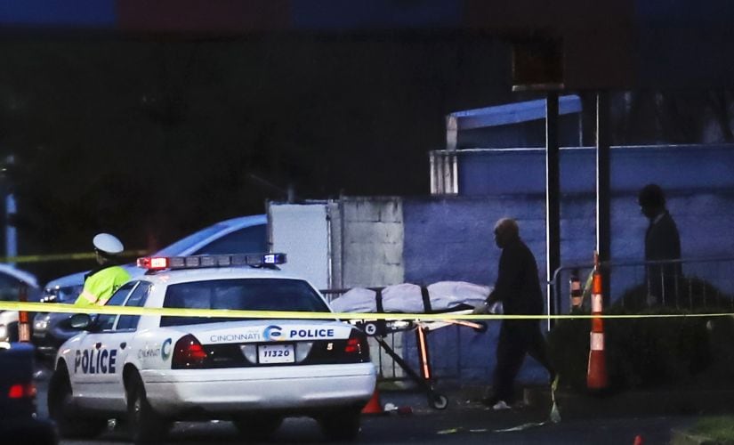 A body is removed as police work at the Cameo club after a fatal shooting on Sunday in Cincinnati. AP