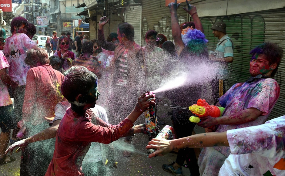 Kids enjoy spraying water on each other on the occasion of ' Holi festival' celebration at Pahargaj area in New Delhi on Monday. PTI Kids enjoy spraying water on each other on the occasion of ' Holi festival' celebration at Pahargaj area in New Delhi on Monday. PTI