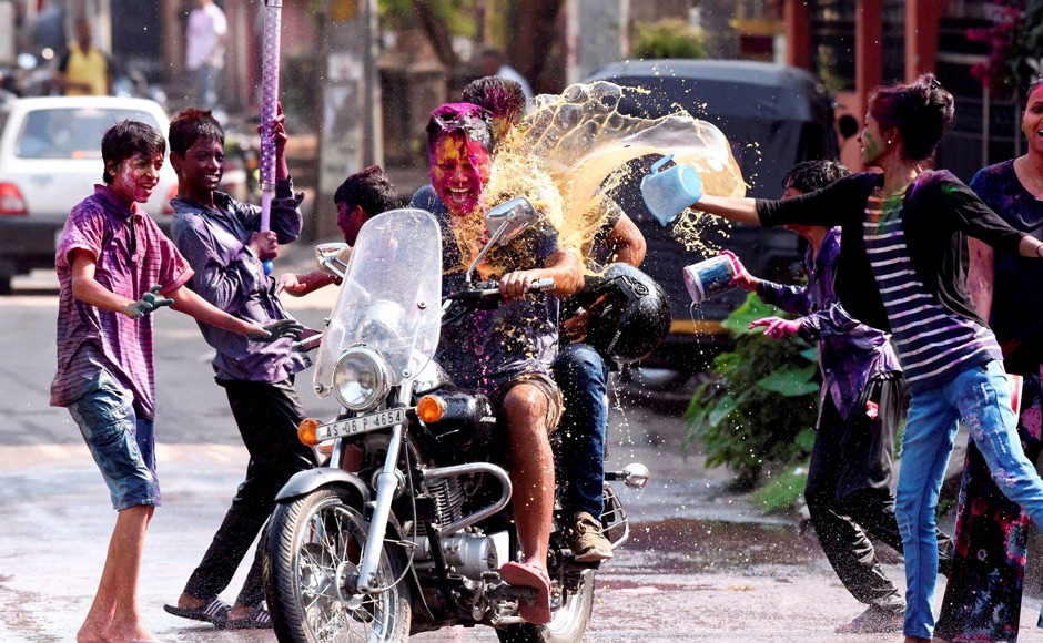 Youths celebrating Holi with colours in Guwahati on Monday. PTI Youths celebrating Holi with colours in Guwahati on Monday. PTI