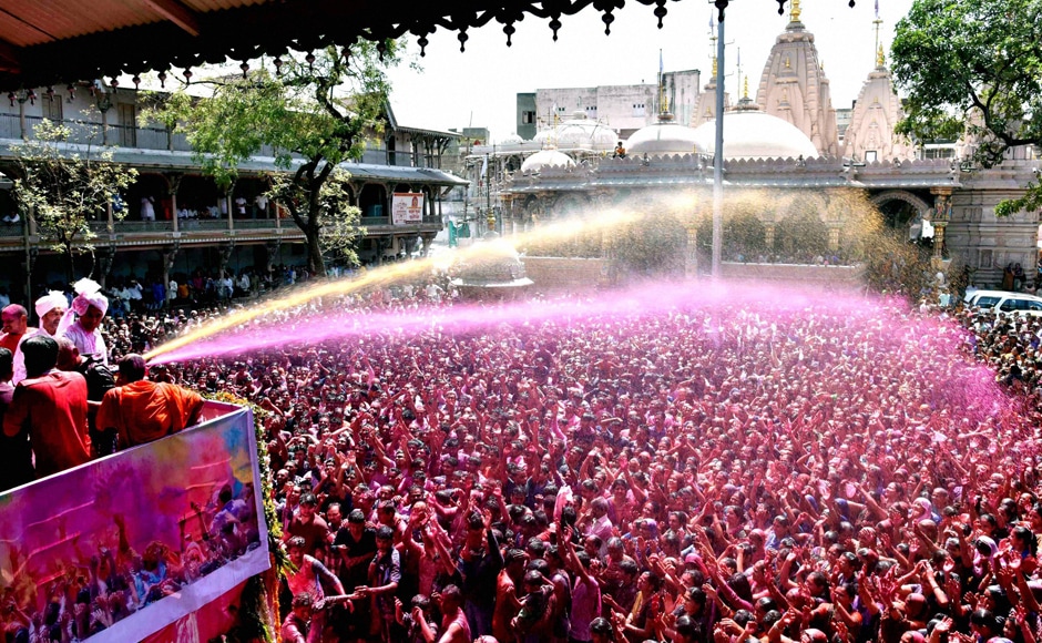 Devotees celebrating Holi festival at Swaminarayan Temple in Ahmedabad on Monday. PTI Devotees celebrating Holi festival at Swaminarayan Temple in Ahmedabad on Monday. PTI