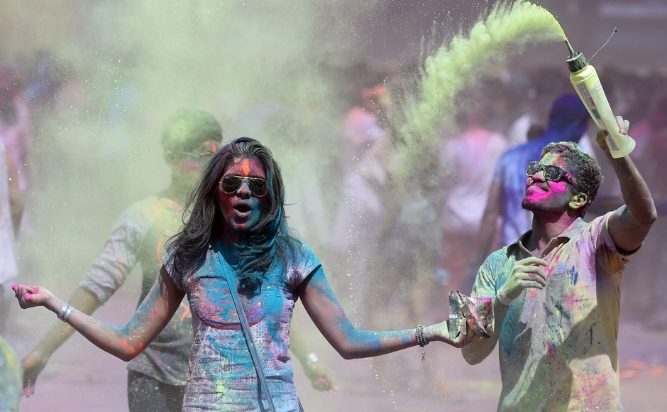 People celebrate the Holi festival in Mumbai on Monday. PTI People celebrate the Holi festival in Mumbai on Monday. PTI