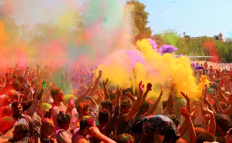 Locals and foreigners celebrating Holi festival at Khasa Kothi in Jaipur on Monday. PTI Locals and foreigners celebrating Holi festival at Khasa Kothi in Jaipur on Monday. PTI