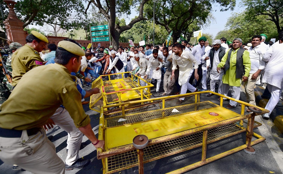 As the gathering approached near Parliament from Sansad Marg around 1.45 pm, police personnel rushed and erected the barricades on the road in front of Parliament Annexe. PTI As the gathering approached near Parliament from Sansad Marg around 1.45 pm, police personnel rushed and erected the barricades on the road in front of Parliament Annexe. PTI