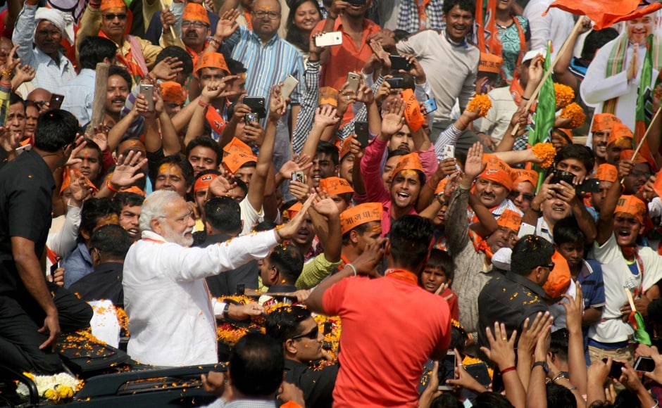 Slogans like Subah Banaras, sham Banaras; Modi tere naam Banaras and 'Modi, Modi' greeted the Prime Minister as he waved from an open top vehicle covered with marigold. PTI Slogans like Subah Banaras, sham Banaras; Modi tere naam Banaras and 'Modi, Modi' greeted the Prime Minister as he waved from an open top vehicle covered with marigold. PTI