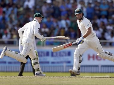 Australia's Shaun Marsh and Peter Handscomb run between the wickets on day five. AP