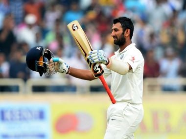 India's Cheteshwar Pujara celebrates after completing a double century. AFP