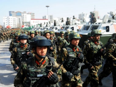 Paramilitary policemen take part in an anti-terrorism oath-taking rally, in Kashgar, Xinjiang Uighur Autonomous Region, China. Reuters