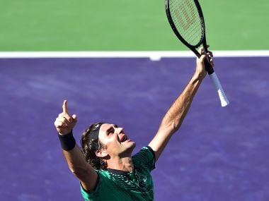 Roger Federer celebrates winning against Stan Wawrinka in the men's singles final. AFP