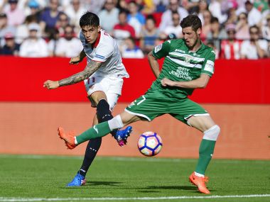 Sevilla's Nicolas Pareja (L) vies with Leganes' midfielder Alexander Szymanowski. AFP