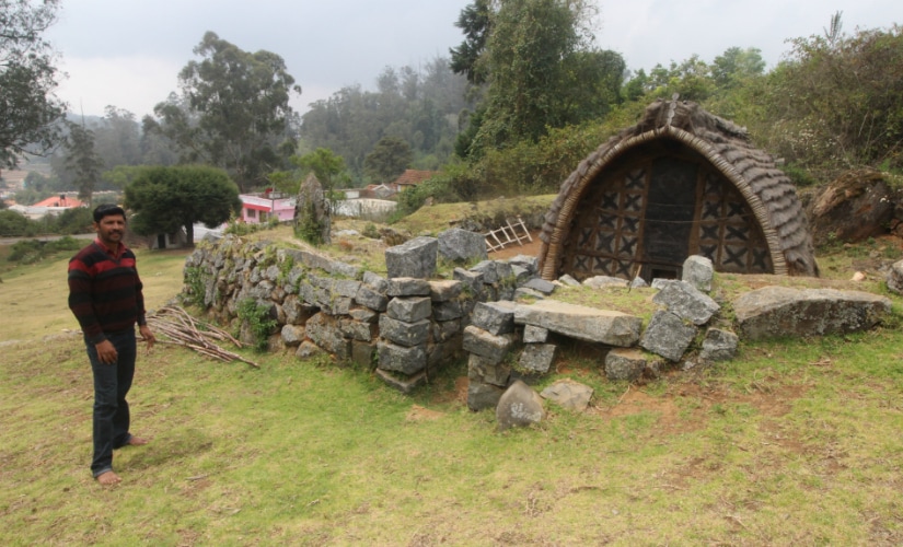 The Toda traditional temple with buffalo motifs and other symbols etched on the temples doors. Firstpost/Sibi Arasu