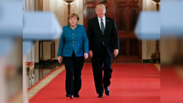 Donald Trump sidesteps blame over wiretap row with Britain, revives another in meeting with Angela Merkel