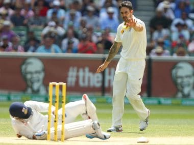 Mitchell Johnson (right) signals to Virat Kohli of India after hitting him with the ball during a run-out attempt during the third Test in December 2014. Getty Images