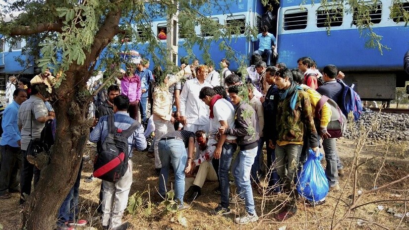 People attend to the injured after the Bhopal-Ujjain train blast. PTI