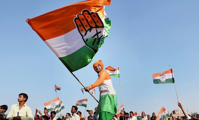 A Congress supporter waving a flag during Rahul Gandhi's rally. PTI