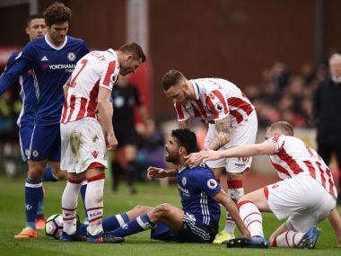 Chelsea's Diego Costa (centre) has words with Stoke City players. AFP