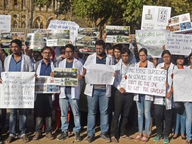 Resident doctors protest at the Azad Maidan on Tuesday. PTI