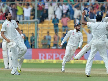 Virat Kohli and his teammates celebrate their victory against Australia in the 2nd Test against Australia in Bengaluru. AFP