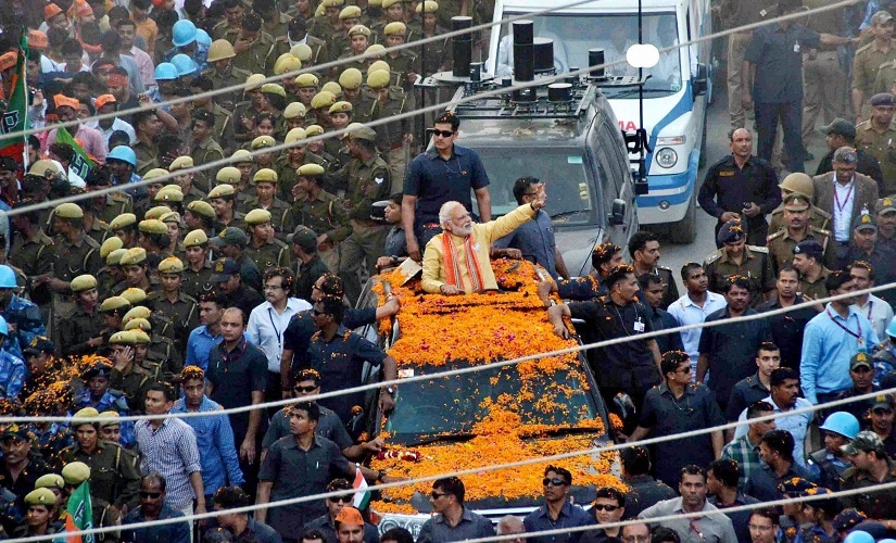 Prime Minister Narendra Modi during his road show in Varanasi on Sunday. PTI