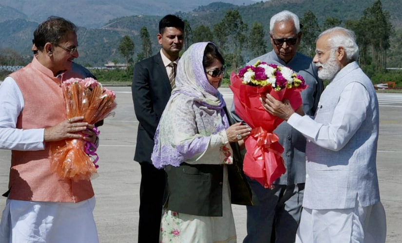 Prime Minister Narendra Modi being received by the Jammu and Kashmir Governor NN Vohra and the chief minister Mehbooba Mufti upon his arrival in the state on Sunday. PTI