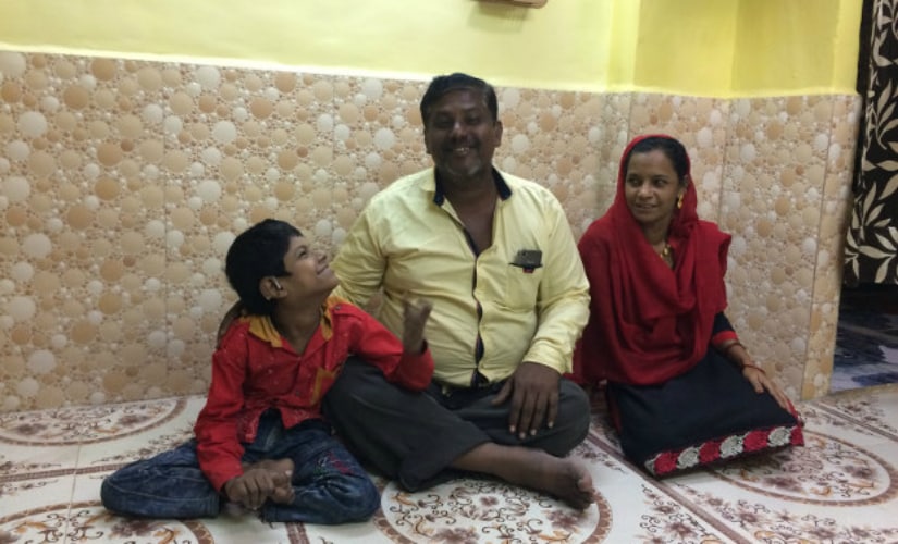 Javed Shaikh with his parents Samsunisa and Abdul Rahman in their new home. Javed’s family had to move to Mumbra, 38 km north in Thane district, because their slum in Sewri had been demolished. Javed no longer goes to school. IndiaSpend