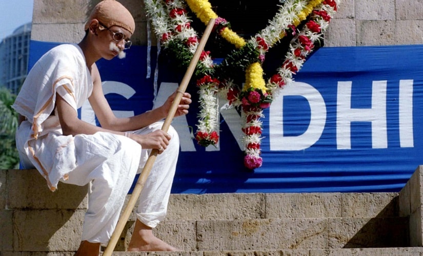A fifteen-year-old school boy plays Mahatma Gandhi in a play during a public function to mark the 50th anniversary of his assassination in Bombay January 30. Gandhi, who is considered the architect of India's independence from British rule, was shot at point blank range in 1948 by Nathuram Godse, a militantly right-wing Hindu. INDIA - RTRAWL5
