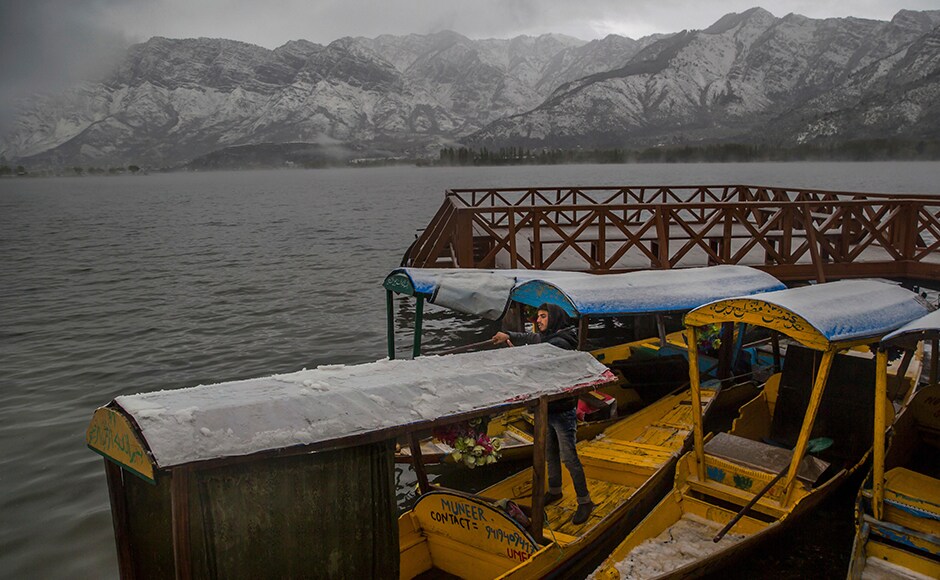 A Kashmiri milkman cycles on a snow-covered road on the outskirts of Srinagar, Indian-controlled Kashmir on Thursday. (AP Photo/Dar Yasin) A Kashmiri milkman cycles on a snow-covered road on the outskirts of Srinagar, Indian-controlled Kashmir on Thursday. (AP Photo/Dar Yasin)