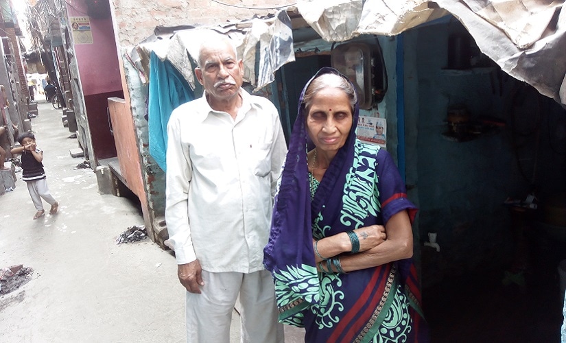 Vimlesh Koli's parents in front of her house in the slums of Sundarnagari. Firstpost/Kangkan Acharyya