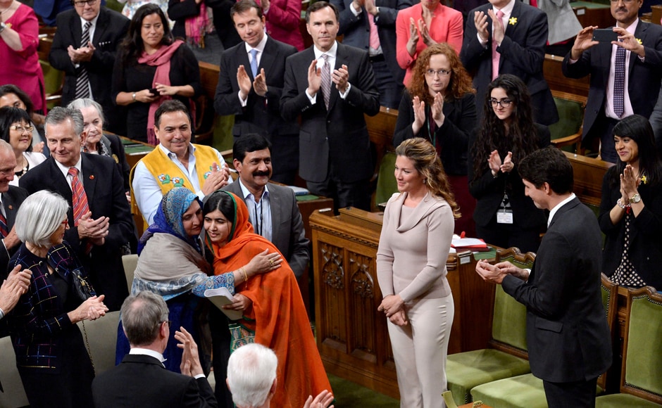 Pakistani activist and Nobel Peace Prize winner Malala Yousafzai, center, is hugged by her mother, Tor Pekai Yousafzai, as she's paid tribute in the House of Commons on Parliament Hill in Ottawa on Wednesday. AP Pakistani activist and Nobel Peace Prize winner Malala Yousafzai, center, is hugged by her mother, Tor Pekai Yousafzai, as she's paid tribute in the House of Commons on Parliament Hill in Ottawa on Wednesday. AP