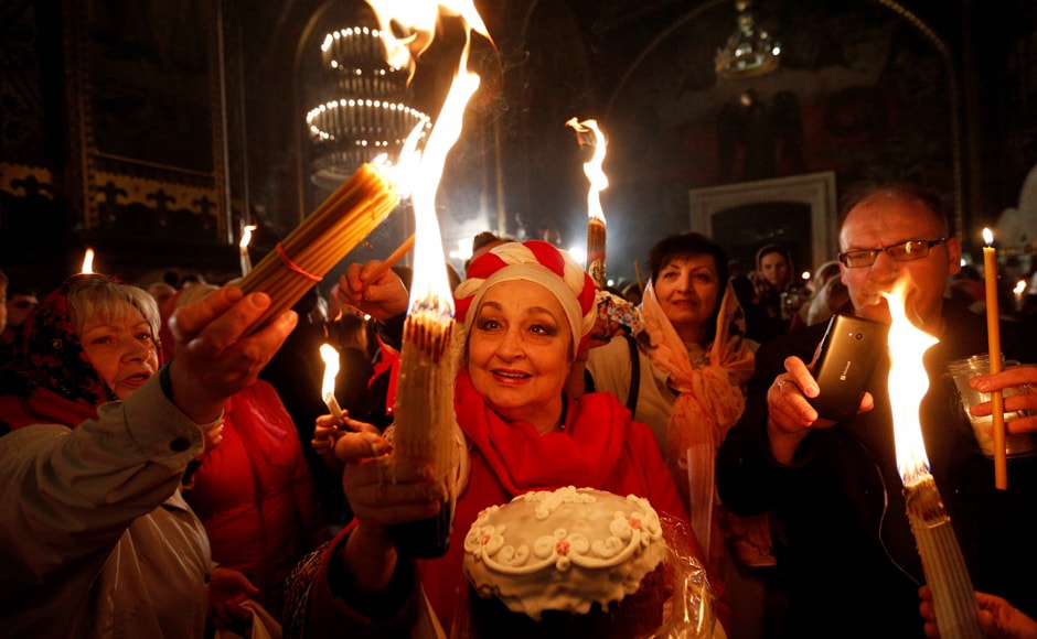 Ukrainian Orthodox celebrates Easter in St. Volodymyr Cathedral during the ceremony of the Holy Fire in Kiev, Ukraine. AP/PTI Ukrainian Orthodox celebrates Easter in St. Volodymyr Cathedral during the ceremony of the Holy Fire in Kiev, Ukraine. AP/PTI