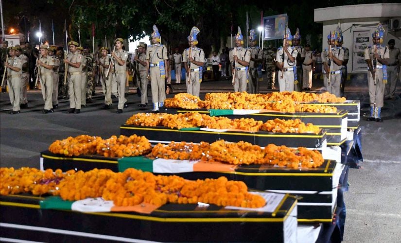 Jawans giving gun salute to martyred CRPF personnel in Patna. PTI