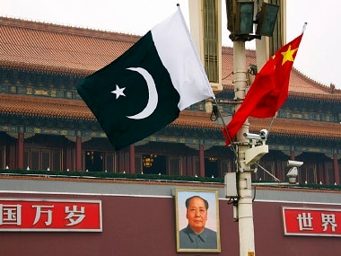 A Pakistan flag alongside a Chinese national flag. Reuters