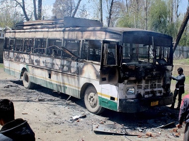 File image of a charred polling staff bus following an attack by a group of protesters during the Srinagar bypolls. PTI