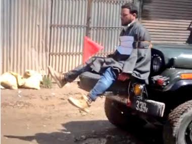 Kashmir: Video shows man tied to army jeep as human shield against stone-pelting protesters Kashmir: Video shows man tied to army jeep as human shield against stone-pelting protesters