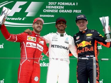 Race winner Lewis Hamilton, with Sebastian Vettel and Max Verstappen on the podium. Getty