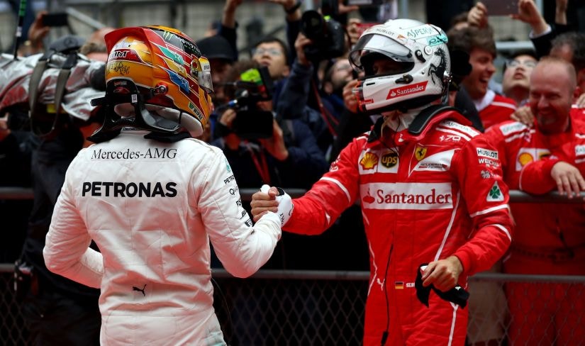 Race winner Lewis Hamilton of Mercedes GP shakes hands with second placed finisher Sebastian Vettel of Ferrari. Getty