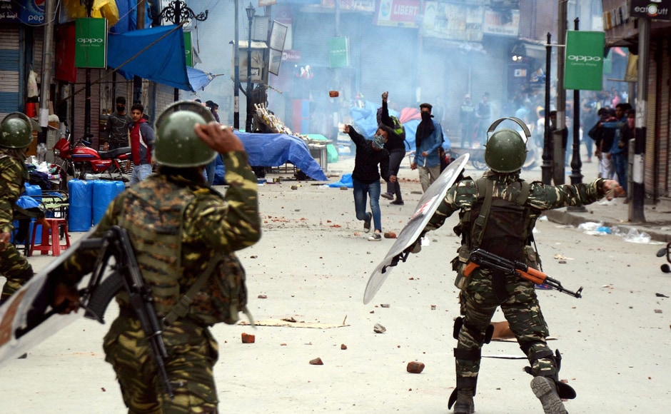 CRPF men and students throwing stones on each other during clashes after schools and colleges reopened on Monday. These educational institutions had remained closed for over a week following widespread protests by students after security forces entered a college in south Kashmir's Pulwama town on April 12. PTI CRPF men and students throwing stones on each other during clashes after schools and colleges reopened on Monday. These educational institutions had remained closed for over a week following widespread protests by students after security forces entered a college in south Kashmir's Pulwama town on April 12. PTI