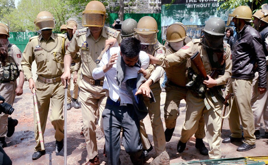 A student being whisked away by police after he was caught from the premises of a college for indulging in stone pelting during protests. Reports said that the students hurled stones, waved Pakistani and Islamic State flags to irk security forces as they were protesting against the Indian force's action against Kashmiri protesters. PTI A student being whisked away by police after he was caught from the premises of a college for indulging in stone pelting during protests. Reports said that the students hurled stones, waved Pakistani and Islamic State flags to irk security forces as they were protesting against the Indian force's action against Kashmiri protesters. PTI