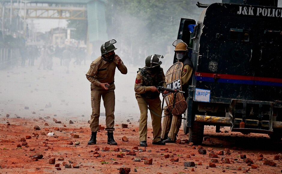 Srinagar: Police in action students who were throwing brick bats on them during clashes in the vicinity of Lal Chowk in Srinagar on Monday. Colleges re-opened in Kashmir after a week's closure but fresh clashes erupted as students staged protests against alleged high-handedness by security forces at Pulwama Degree College recently. PTI Photo by S Irfan (PTI4_24_2017_000204B) Srinagar: Police in action students who were throwing brick bats on them during clashes in the vicinity of Lal Chowk in Srinagar on Monday. Colleges re-opened in Kashmir after a week's closure but fresh clashes erupted as students staged protests against alleged high-handedness by security forces at Pulwama Degree College recently. PTI Photo by S Irfan (PTI4_24_2017_000204B)