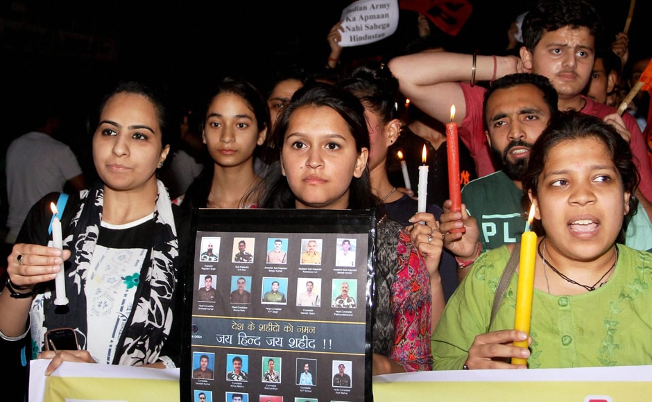 ABVP students during a candlelight vigil to pay tribute to CRPF personnel, who were killed in Sukma attack, in Jammu on Tuesday. PTI ABVP students during a candlelight vigil to pay tribute to CRPF personnel, who were killed in Sukma attack, in Jammu on Tuesday. PTI