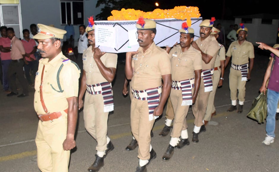 Policemen carry the body of a CRPF personnel at Madurai Airport on Tuesday. PTI Policemen carry the body of a CRPF personnel at Madurai Airport on Tuesday. PTI