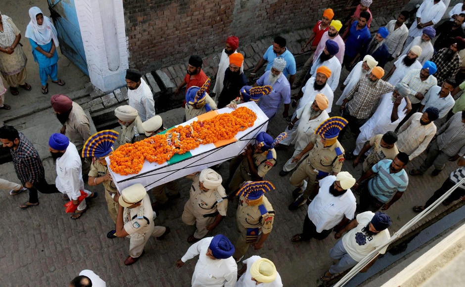 CRPF martyr Inspector Raghbir Singh being carried during his funeral in village Sathiala, some 50 km from Amritsar on Tuesday. PTI CRPF martyr Inspector Raghbir Singh being carried during his funeral in village Sathiala, some 50 km from Amritsar on Tuesday. PTI