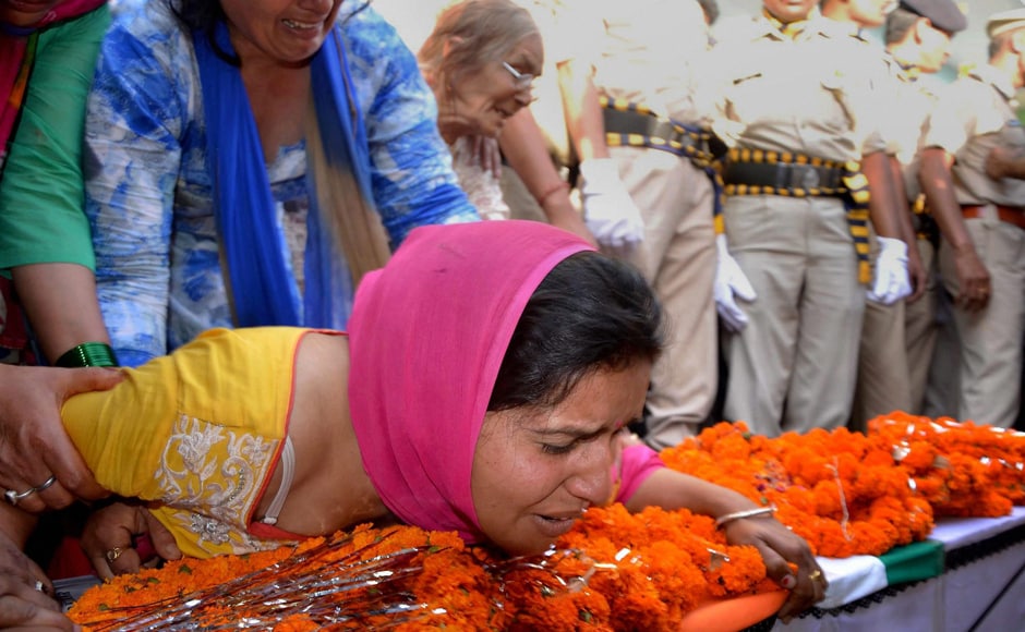 Wife of CRPF personnel Surender Thakur, who was killed in Sukma attack, mourn the loss at his native village Ner Chowk Mandi on Tuesday. PTI Wife of CRPF personnel Surender Thakur, who was killed in Sukma attack, mourn the loss at his native village Ner Chowk Mandi on Tuesday. PTI