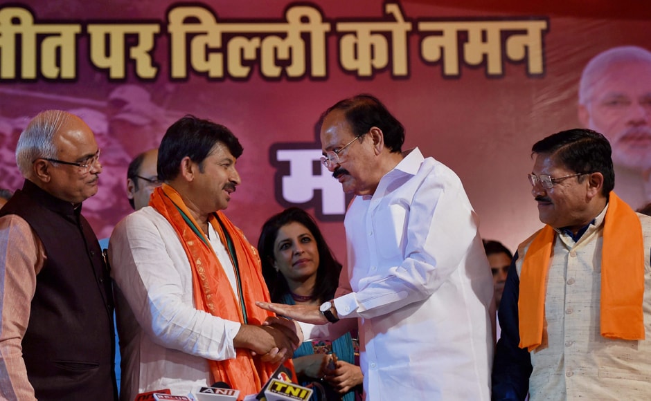 Union Minister M Venkaiah Naidu greets Delhi BJP President, Manoj Tiwari as party's Delhi in-charge Shyam Jaju (R) looks on during a press conference after huge victory in the MCD elections, in New Delhi on Wednesday. PTI Union Minister M Venkaiah Naidu greets Delhi BJP President, Manoj Tiwari as party's Delhi in-charge Shyam Jaju (R) looks on during a press conference after huge victory in the MCD elections, in New Delhi on Wednesday. PTI