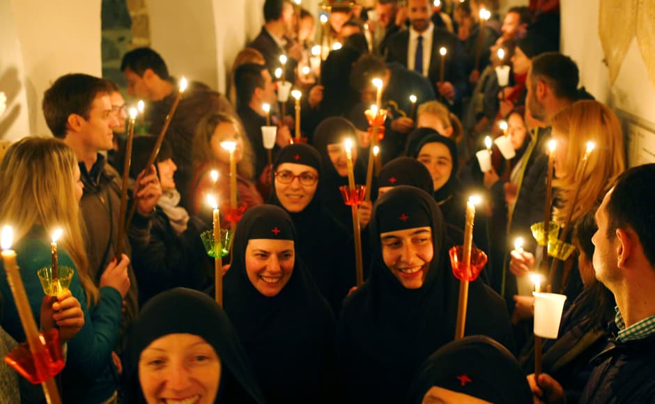 Saturday's late-night service came just hours after Francis presided over the evocative torch-lit Good Friday procession at Rome's Colosseum, where he repeatedly denounced the Saturday's late-night service came just hours after Francis presided over the evocative torch-lit Good Friday procession at Rome's Colosseum, where he repeatedly denounced the