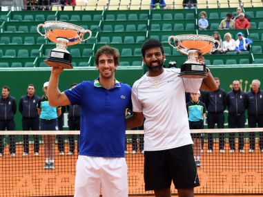 Rohan Bopanna and his partner Pablo Cuevas with the men's doubles trophy. Getty